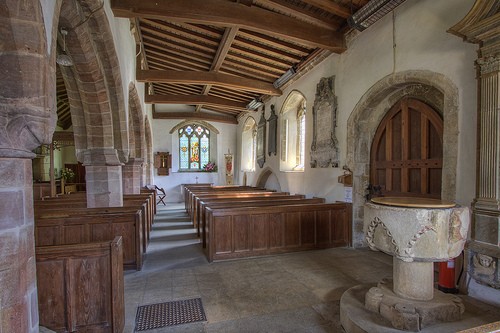 The south aisle with south doorway and font
